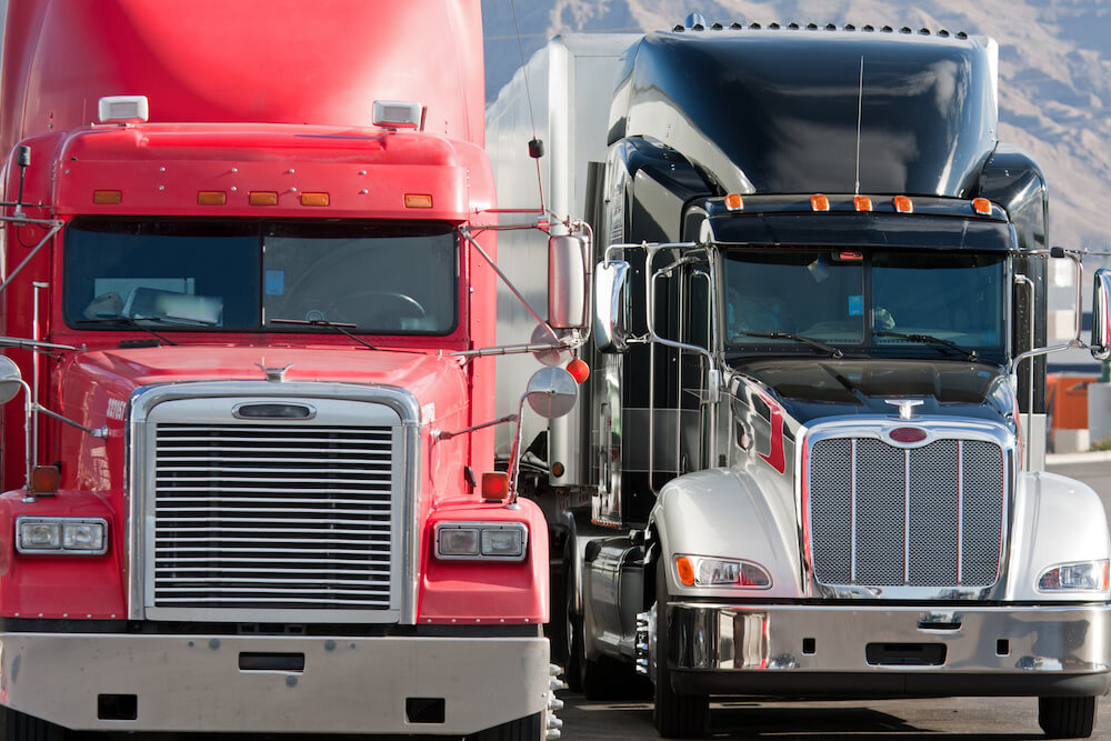 An image of two trucks side by side, likely covered by truck insurance.
