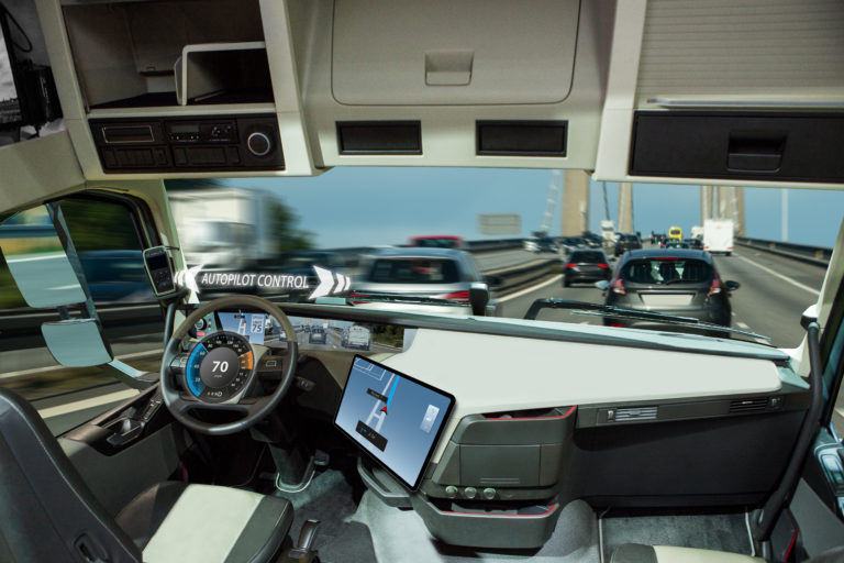 An image of the interior of a cab as it's driving down the road.